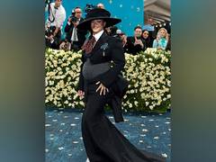 
      
      Rihanna makes comeback to Met Gala, debuts baby bump
      
      