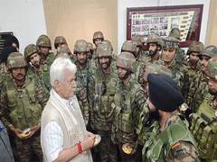 
      
      J-K LG Manoj Sinha meets security forces in Uri, review ground si
      
      
