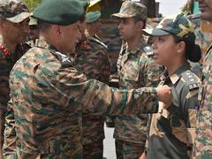 
      
      COAS Dwivedi felicitates Neha Bhandari from BSF Jammu 
      
      