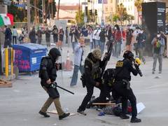 
      
      Protests in LA intensify over federal immigration sweeps,
      
      