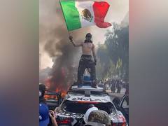 
      
      Mexican flag becomes symbol of LA immigration protests
      
      