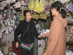 
      
      Manipur woman crafts dolls from corn waste
      
      