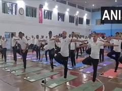 
      
      Rajnath Singh takes part in International Yoga Day celebrations i
      
      