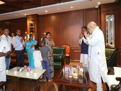 
      
      Amit Shah meets family of police officer killed in IED blast
      
      