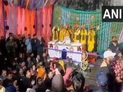 
      
      Pilgrims chant bhajans
      
      