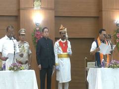 
      
      Tripura CM attends oath-taking ceremony of Kishore Barman
      
      
