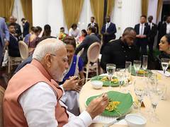 PM Modi attends dinner hosted by Trinidad and Tobago counterpart