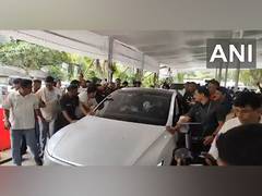 
      
      Eknath Shinde rides Tesla car, says 