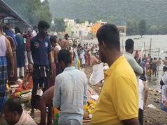 
      
      Thousands of devotees perform ancestral rites in the Kaveri River
      
      