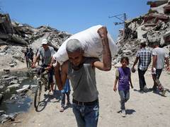 
      
      Isarel says it allowed aid flow in Gaza to avoid sanctions
      
      
