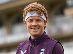 
      
      England players wearing special headbands 
      
      