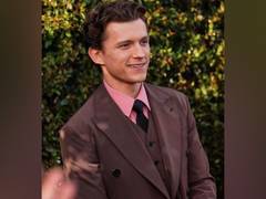 
      
      Tom Holland reacts to James Bond casting rumours
      
      