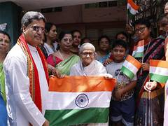 
      
      Manik Saha distributes national flags in Agartala 
      
      