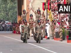 
      
      BSF jawans perform bike stunts at Attari border on 79th I Day
      
      