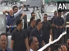 
      
      PM Modi receives grand welcome from supporters before inauguratio
      
      