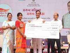 
      
      Assam CM Sarma presents cheques to 5,791 women beneficiaries
      
      