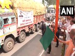 
      
      UP CM Yogi flags of 48 trucks of relief materials 
      
      