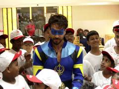
      
      Tiger Shroff dons superhero costume for cancer-battling children
      
      