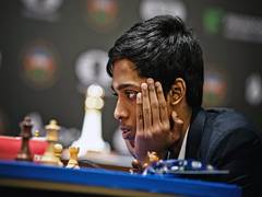 
      
      R Praggnanandhaa plays a game of chess with Gautam Adani
      
      