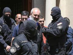 
      
      Armenian Archbishop jailed for two years on coup charges 
      
      