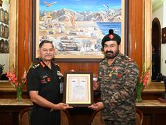 
      
      Chief of Army Staff facilitates actor and Lt. Col (Hony) Mohanlal
      
      