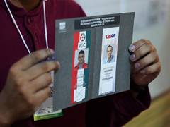 
      
      Polls open in Bolivia's presidential run-off as country faces dee
      
      