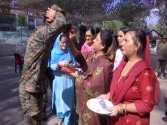 
      
      J-K: Womens apply 'Tilak' on Indian Army personnel on Bhai Dooj
      
      
