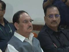 
      
      BJP National President JP Nadda along with other ministers listen
      
      