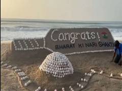 
      
      Artist creates sand sculpture at Puri Beach to celebrate Indian w
      
      