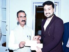 
      
      Himachal CM receives Rs 21,000 cheque for 