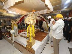 
      
      CM Bhupendra Patel offer prayers and pays respect to Guru Granth
      
      