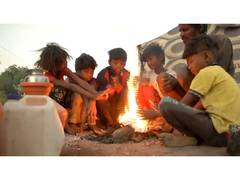 
      
      Winter strikes Karnataka's Kalaburgi, children gather around fire
      
      