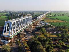 
      
      130 m span of a 230 m long steel bridge launched over NH-64 & Ind
      
      