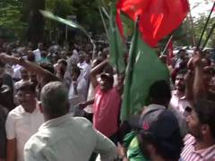 
      
      UDF workers celebrate outside Maharaja's College in Kochi
      
      