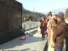 
      
      Tourists pay tribute at Shaheed Marg in Pahalgam
      
      