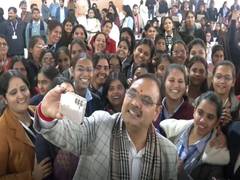 
      
      Bhajanlal Sharma engages with female students
      
      