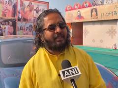 
      
      Satua Baba over his luxury car collection at Magh Mela
      
      