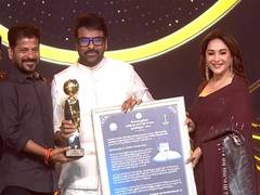 
      
      Madhuri Dixit presents NTR National Award to Chiranjeevi 
      
      