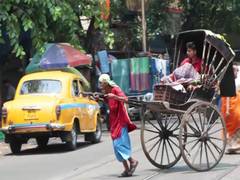 
      
      Hand-pulled rickshaw pullers struggle to stay afloat in Kolkata
      
      