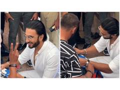 
      
      Ranveer Singh interacts with wheelchair cricketer Bhima Khunti
      
      
