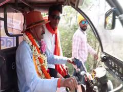
      
      BJP candidate campaigns in E-rickshaw in West Bengal
      
      