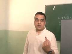 
      
      Sanghavi votes in Surat
      
      