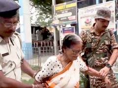 
      
      Security forces officials assist elderly voters to cast their votes
      
      