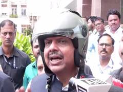 
      
      Maharashtra CM reaches Vidhan Bhavan for MLC oath-taking on bike
      
      