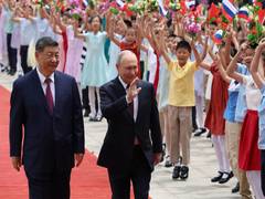 
      
      Xi enjoys tête-à-tête with Putin
      
      