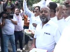 
      
      Karnataka: Supporters celebrate outside Depy CM's residence
      
      