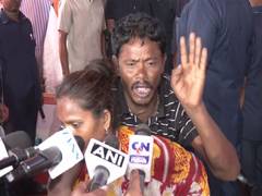 West Bengal: Woman carries husband on back to attend Suvendu Adhikari's public grievance meeting in Kolkata
