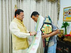 
      
      Dhami felicitates MFN Lightweight World Champion Digambar Rawat
      
      