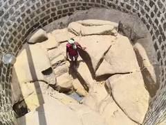 
      
      Nawapara villagers descend into dried-up wells to fetch water
      
      