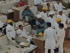
      
      Opposition corporators wear helmets in PMC House
      
      